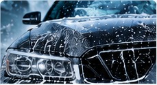 Compact car being hand washed